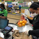 An Instacart shopper bagging groceries